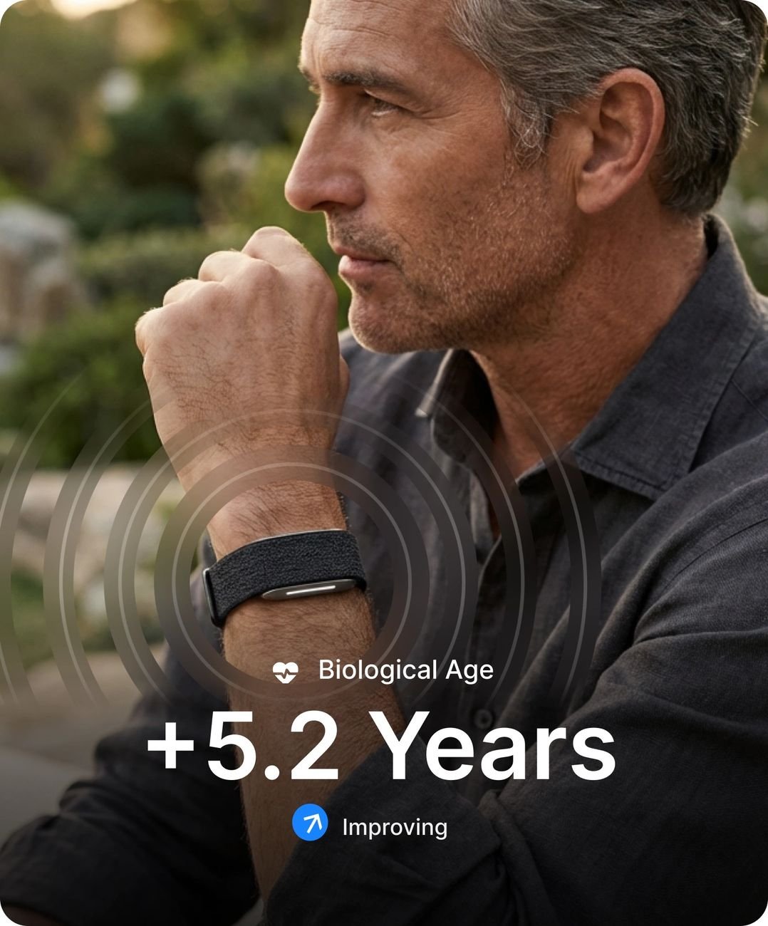 Man wearing the Hume Watch with biological age and chronic illness risk shown in app