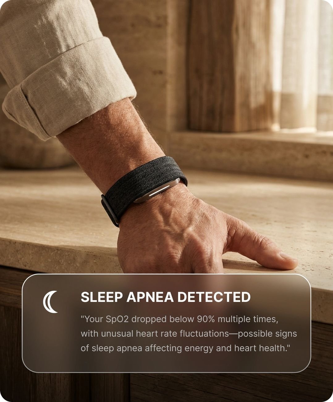Hume Watch on wrist with a sleep apnea alert shown in the companion app