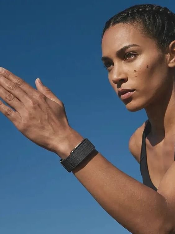 Athletic woman wearing the Hume Watch outdoors — building metabolic momentum